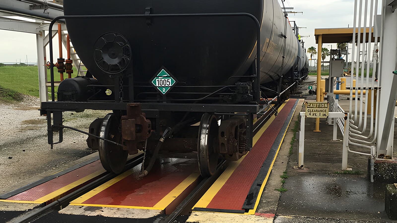 Tank car at rest on a rail scale at a loading rack