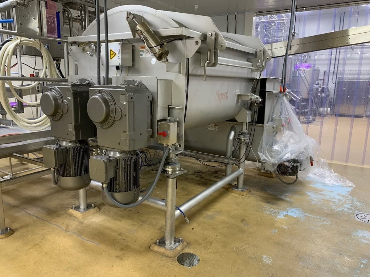 Industrial mixer supported on weigh modules at each foot in a food plant
