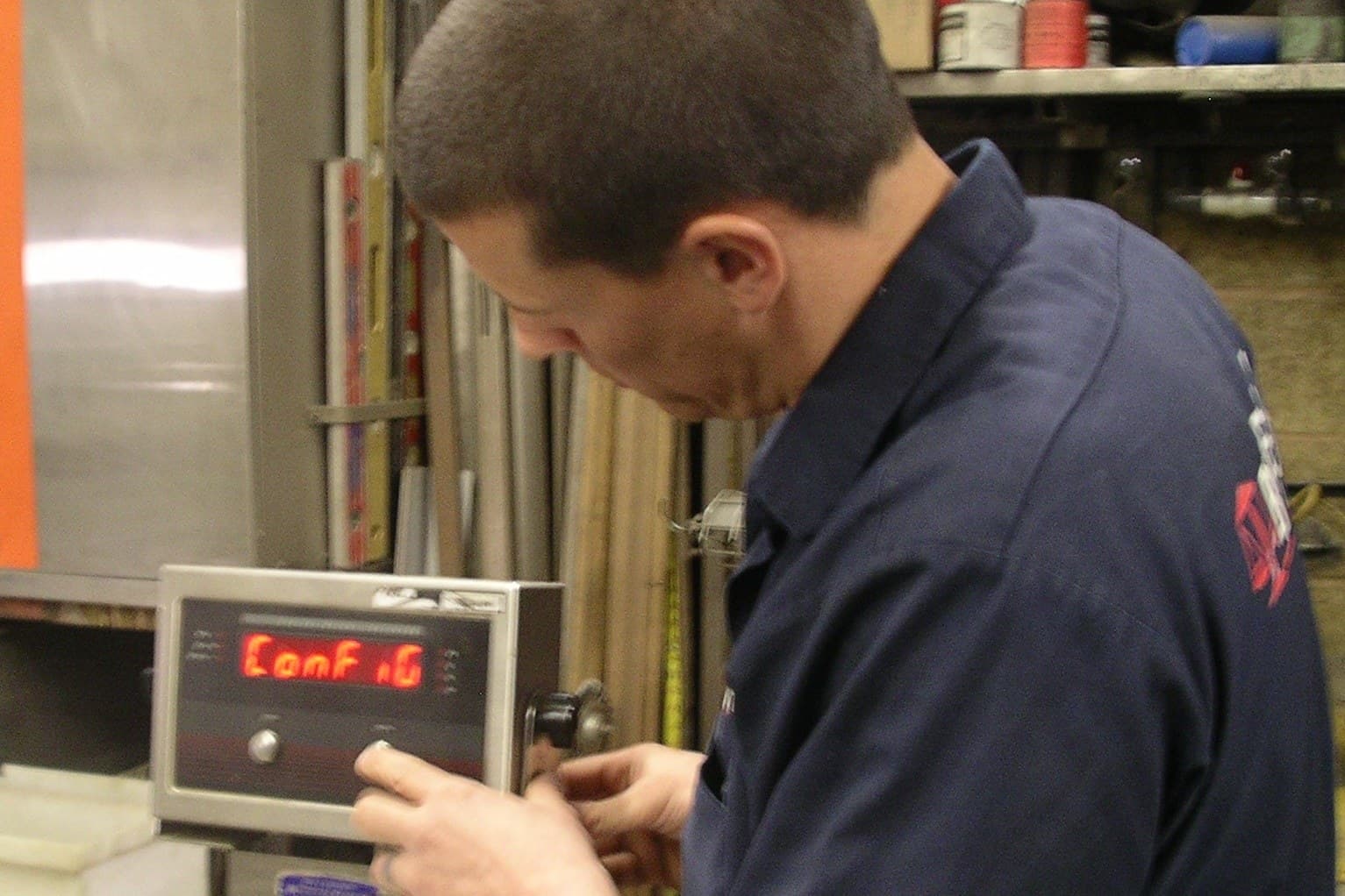 Bitterman technician configuring the indicator on a bench scale